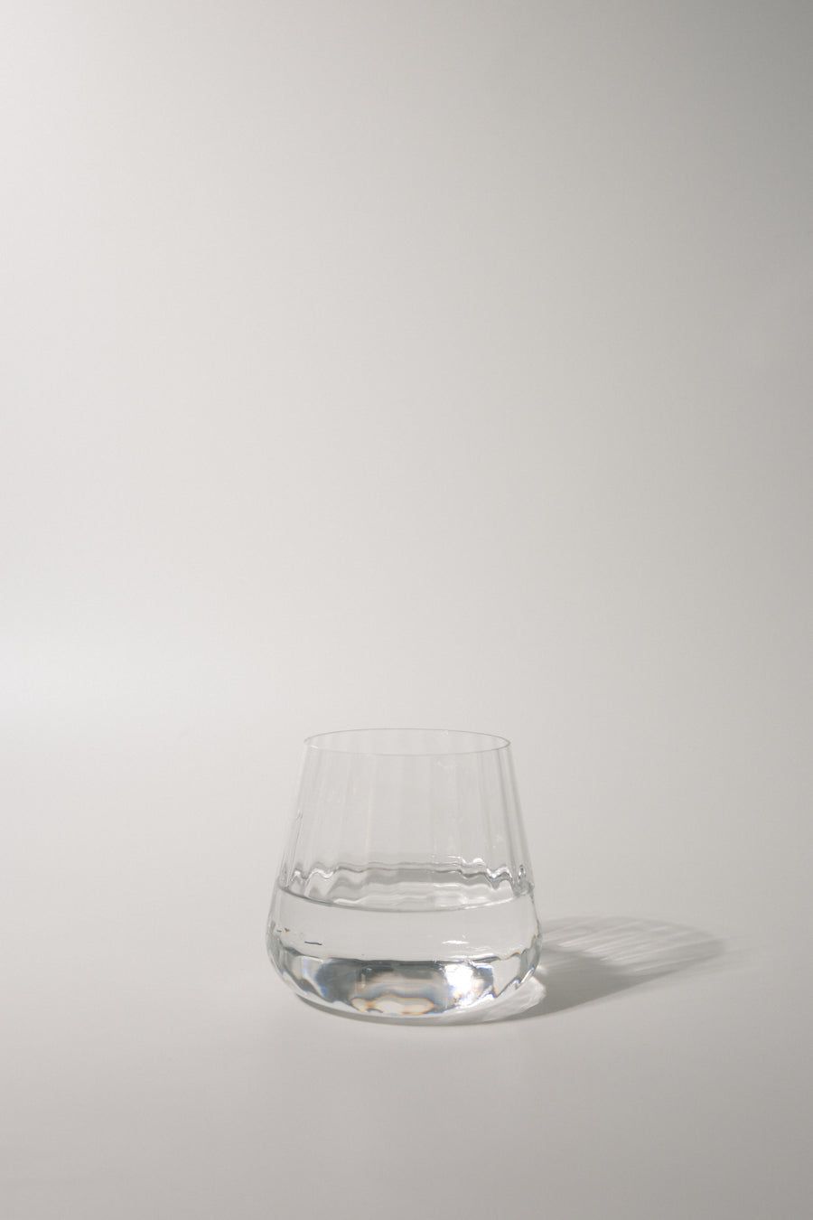 Clear glass on a light gray background