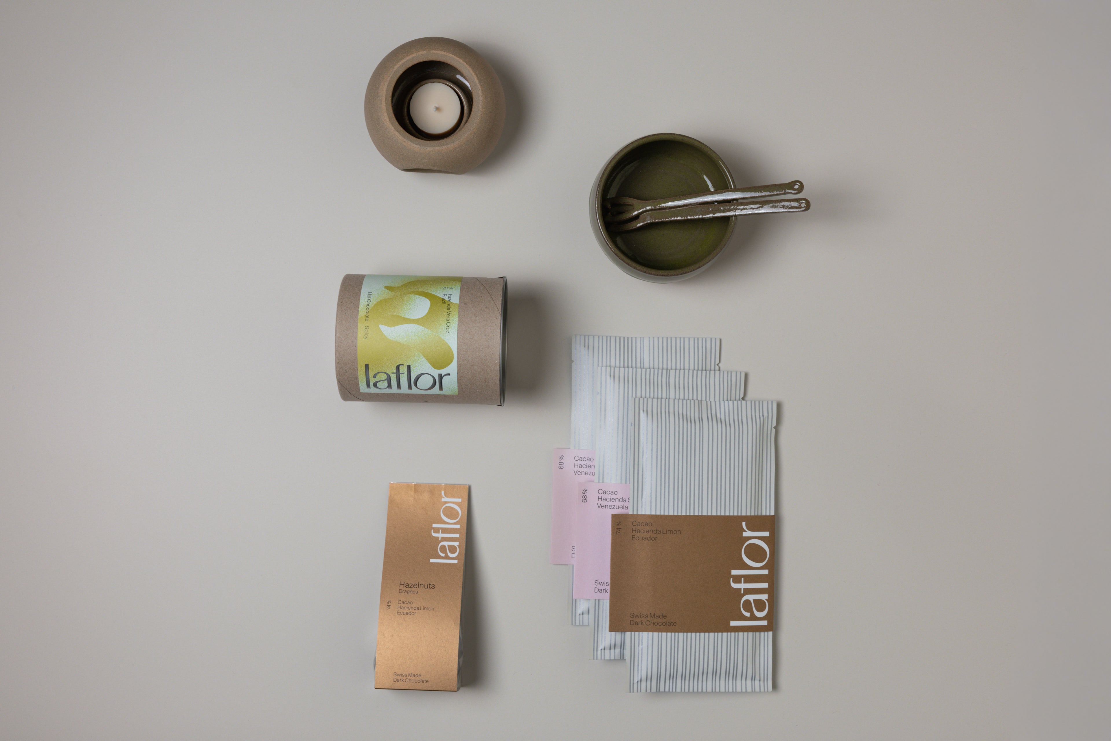 Collection of Laflor products including a can, box, and packets on a neutral background