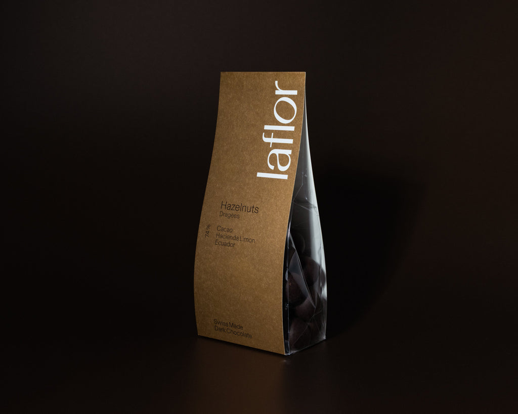 Kraft paper bag with 'Laflor' branding on a dark background