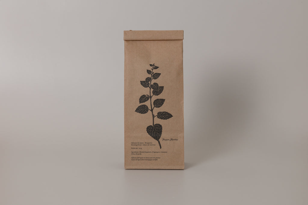 Kraft paper packaging with a leaf design on a gray background