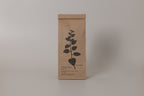 Kraft paper packaging with a leaf design on a gray background