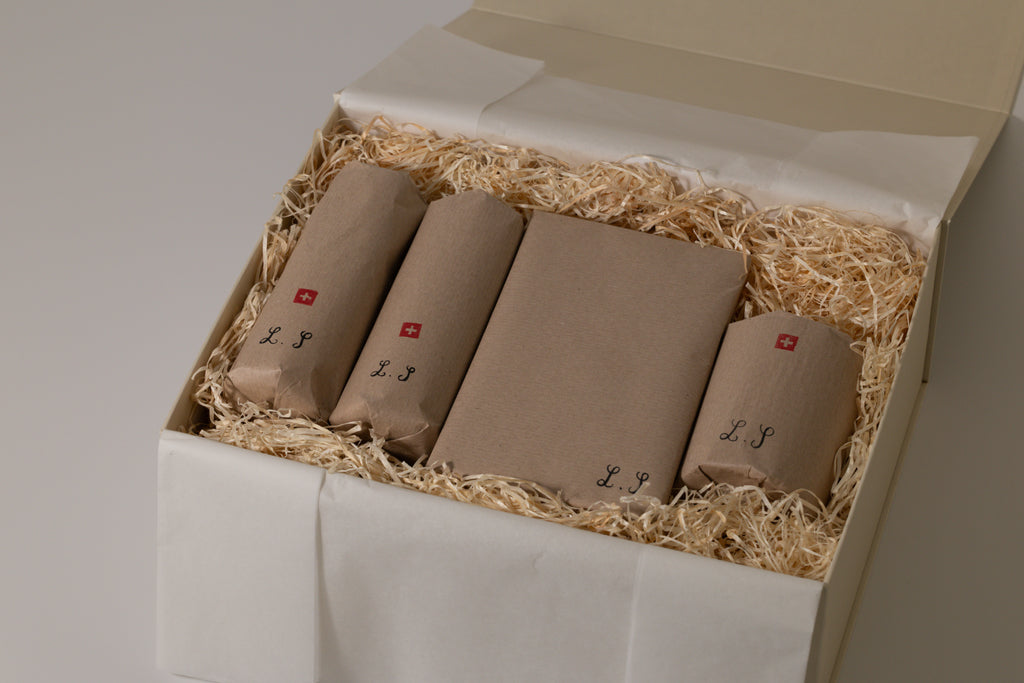 wrapped products in beige box and white background, and swiss flag